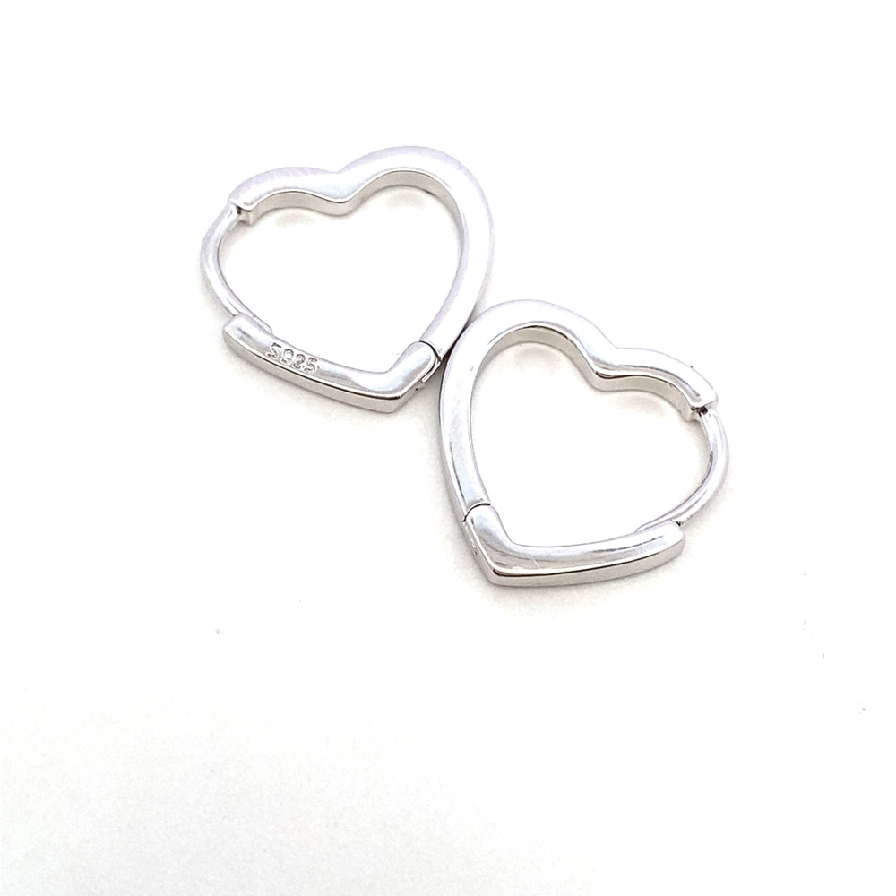 E8037 SILVER MID OPEN HEART SHPD CLIP ON EARRNG 2.17G